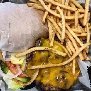 Cheeseburger and fries to go. Bun packed separately so it doesn&apos;t get soggy!