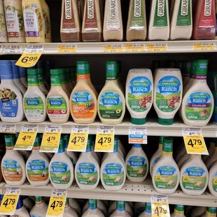 a variety of salad dressings for sale in a grocery store