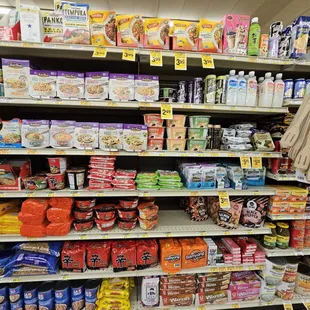 a grocery store aisle with a variety of food items