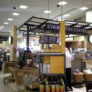 a man standing in a coffee shop