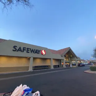 a shopping cart in front of a safeway store