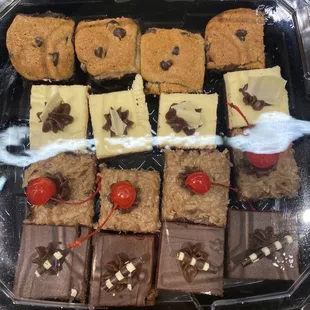 a tray of assorted desserts