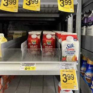 a shelf of milk and yogurt