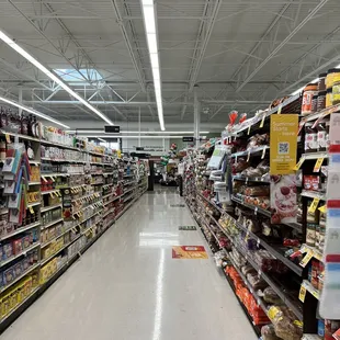 a grocery store aisle with a variety of products