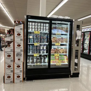 a refrigerated refrigerator in a grocery store