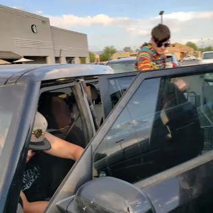 Thieves loading unpaid groceries in the car.