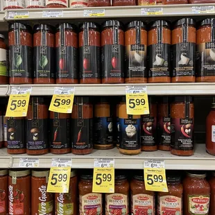 a variety of sauces for sale in a grocery store
