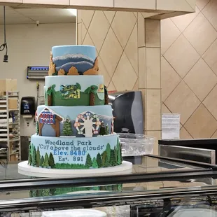 a three tiered cake in a bakery
