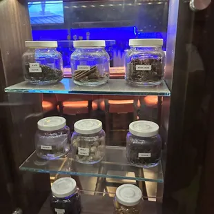 a display case with a variety of food items