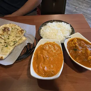 Garlic naan, butter chicken and aloo gobi