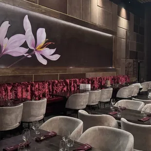 Elegant seating area highlighting a mural on the wall