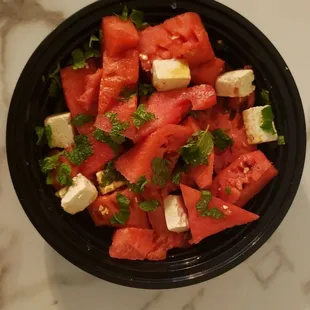 Watermelon salad ... generous serving of seedless melon drizzled with fresh pomegranate juice, topped with fresh mint &amp; feta chunks