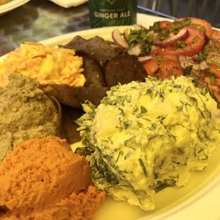 The Gyro plate with potato salad, fresh vegetables, black olive hummus and sun-dried tomato hummus. OUT OF THIS WORLD.