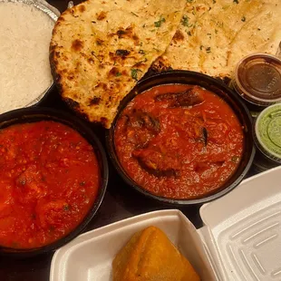 Delicious garlic naan, basmati rice, massive samosas, shrimp vindaloo &amp; an eggplant dish. All so, so good!!!