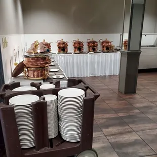 a table with plates and pans on it