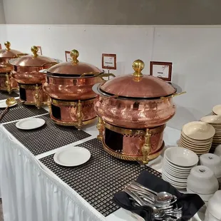 a long table with plates and silverware