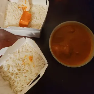 a bowl of rice and a bowl of gravy