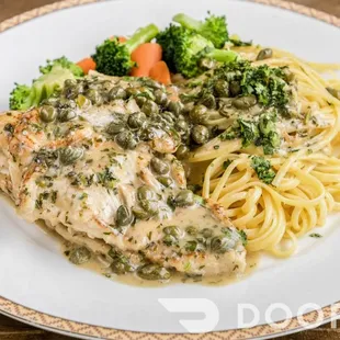 a plate of pasta with chicken and broccoli