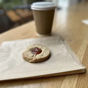 Drip coffee and a thumb print cookie. That&apos;s a dollop of jam.