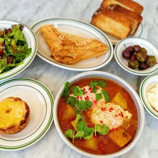 Arabic Breakfast plus potato curry bourekas and portuguese