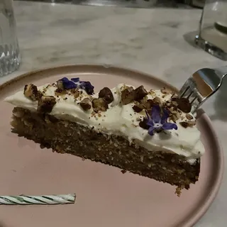 banana cake with soft cheese frosting, baharat spiced pecan