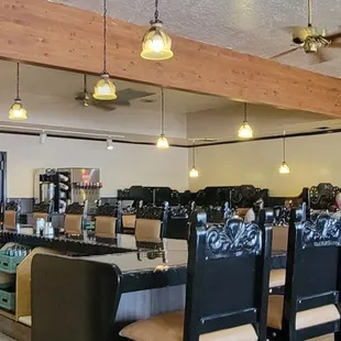 a dining area with a table and chairs