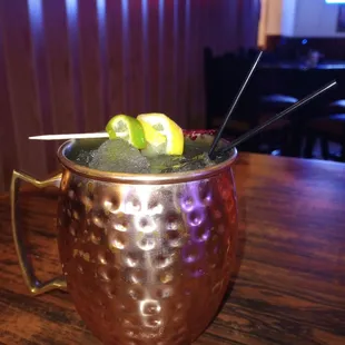 a moscow mule with lime and strawberries