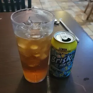 a cold drink and a can of lemonade