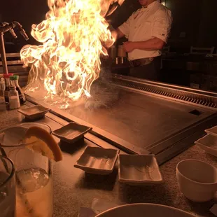 a chef cooking on a grill