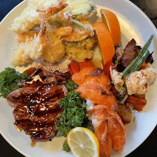 Steak and lobster combination plate with the tempura vegetables. Perfectly cooked!