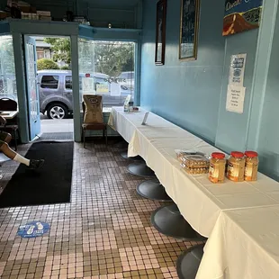 tables with white tablecloths on them