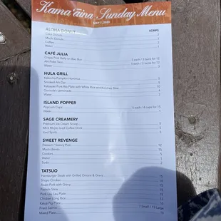 a menu on a wooden bench