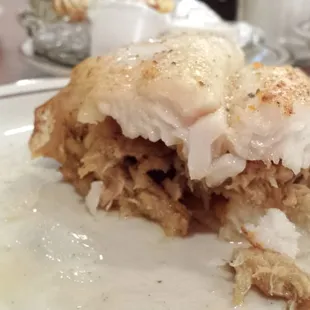detail of the flounder and shrimp/crab filling as it disappears. there was a filet of flounder on top and under!