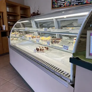 a display of cakes in a bakery