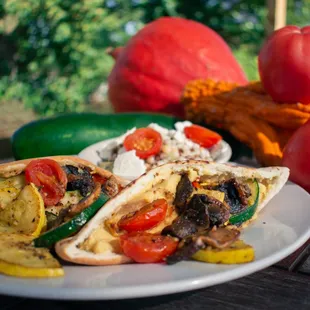 a plate of vegetables and a pita