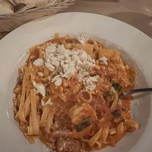 Fettuccine De Mare off specials menu with shrimp, scallops, and crab in a rose sauce.