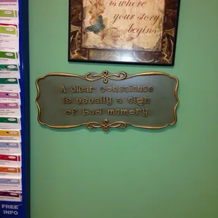 a sign on the wall of a pharmacy office