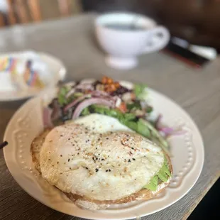 Avocado Toasts with sunny side up egg with salad