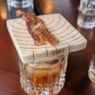 Candied bacon atop the Bacon Washed Smoked Old Fashion