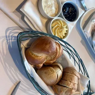 a basket of bread and other food items