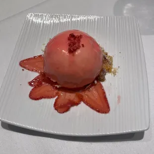 a strawberry dessert on a white plate
