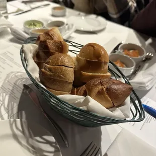 3 loaves of bread with accompanying butter/jams