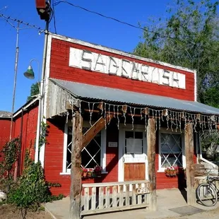 a bicycle parked in front of the store
