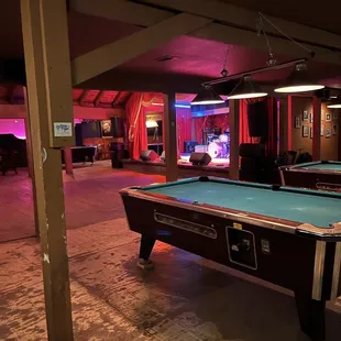 View of dance floor stage from pool table section
