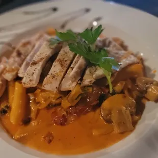 a plate of food with meat and vegetables