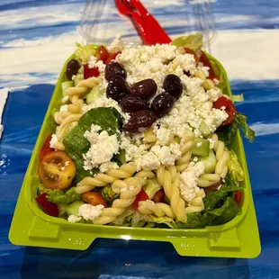 a salad in a plastic container