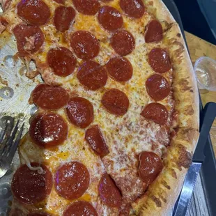 This was the Giant pepperoni pizza sorry my family never waits to dig in! We love the pizza and slices are big and filling with just one!