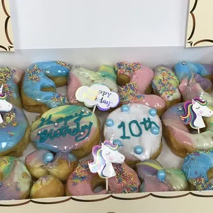 a box of decorated donuts