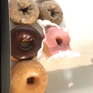 Assorted donuts: Blueberry, Strawberry, Chocolate and glaze. All delicious