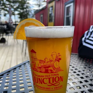 a glass of beer on a table